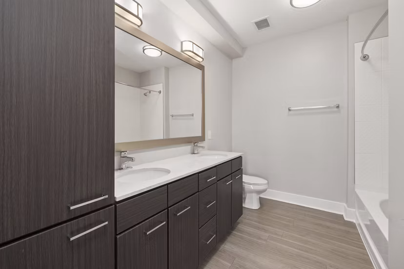 Elegant bathroom with modern fixtures at Cadence Music Factory Apartments, offering luxurious living spaces in a vibrant community