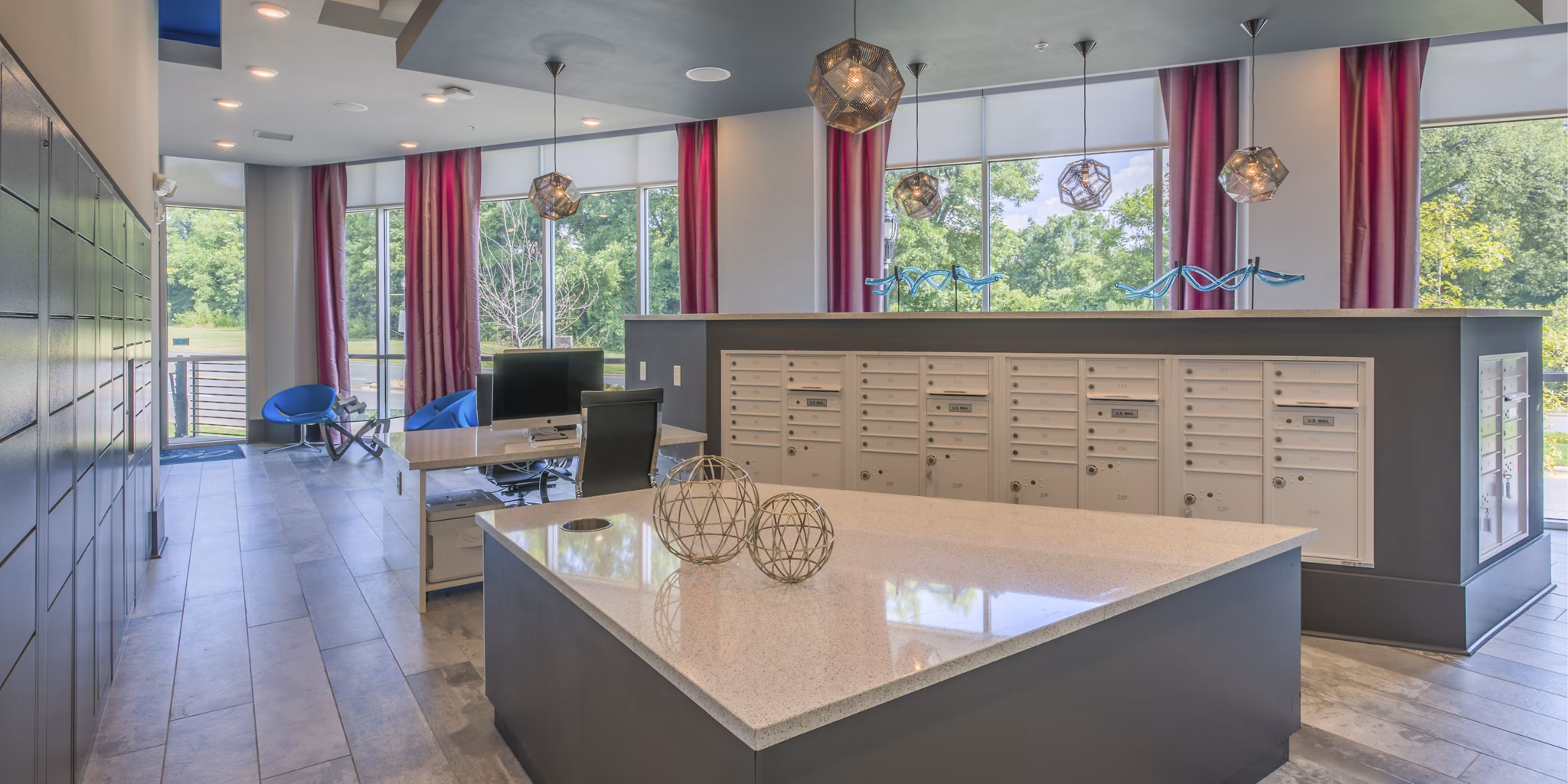 Mail room with organized mailboxes in Cadence Music Factory Apartments
