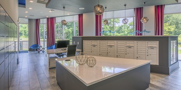 Mail room with organized mailboxes in Cadence Music Factory Apartments