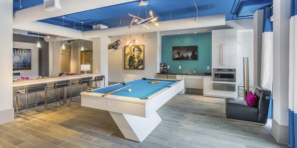 Clubhouse featuring modern design and entertainment spaces at Cadence Music Factory Apartments