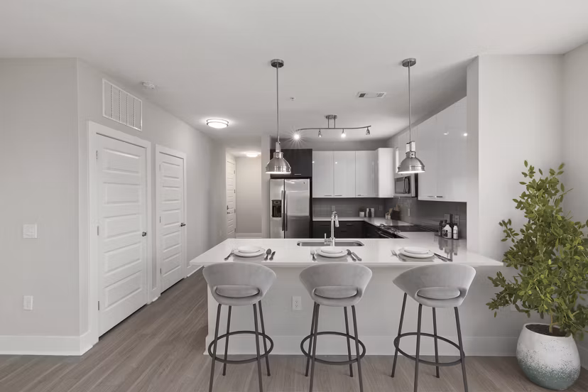 Modern kitchen with sleek appliances at Cadence Music Factory Apartments, a luxury community by Greystar