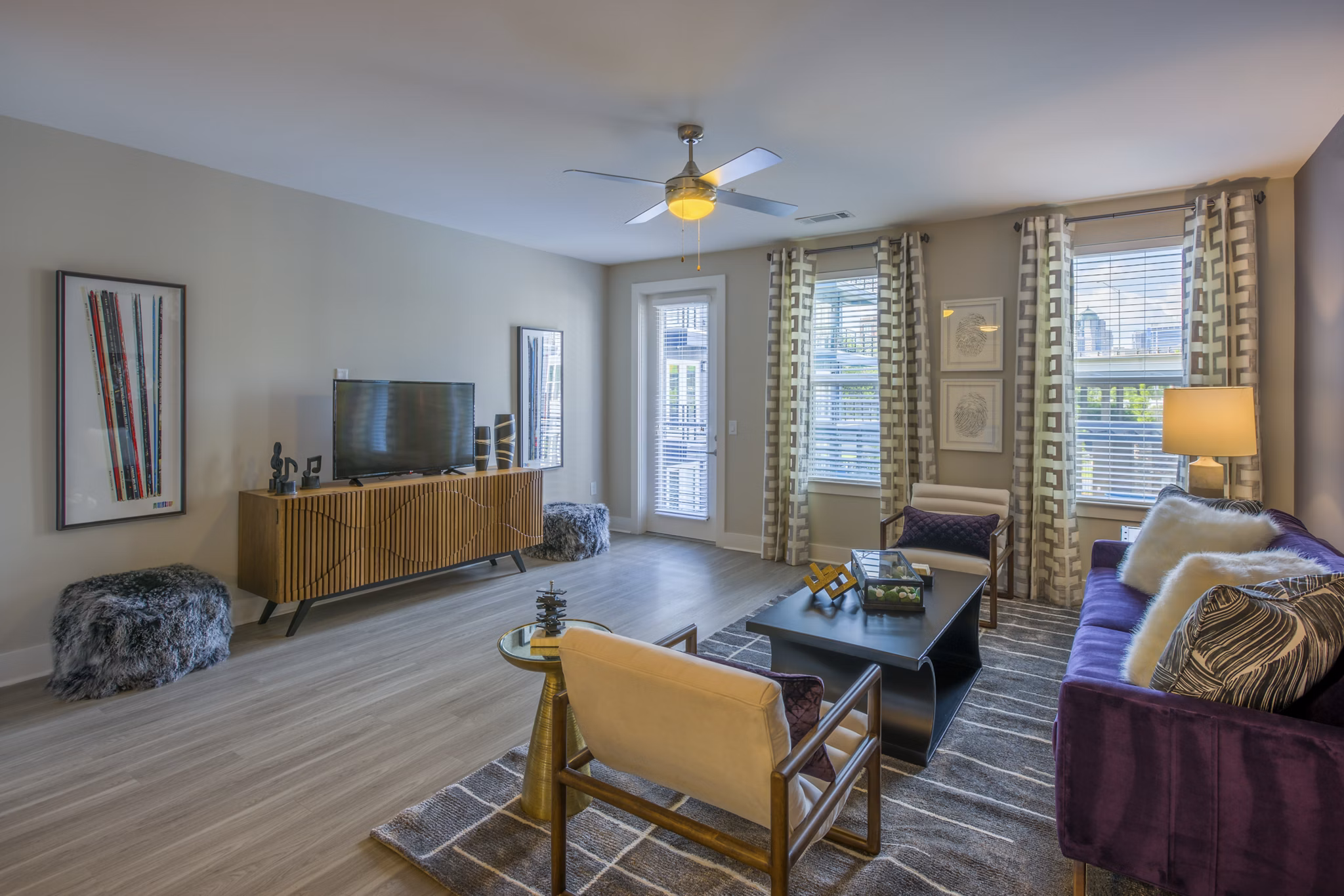 Spacious living room with modern decor in Cadence Music Factory Apartments
