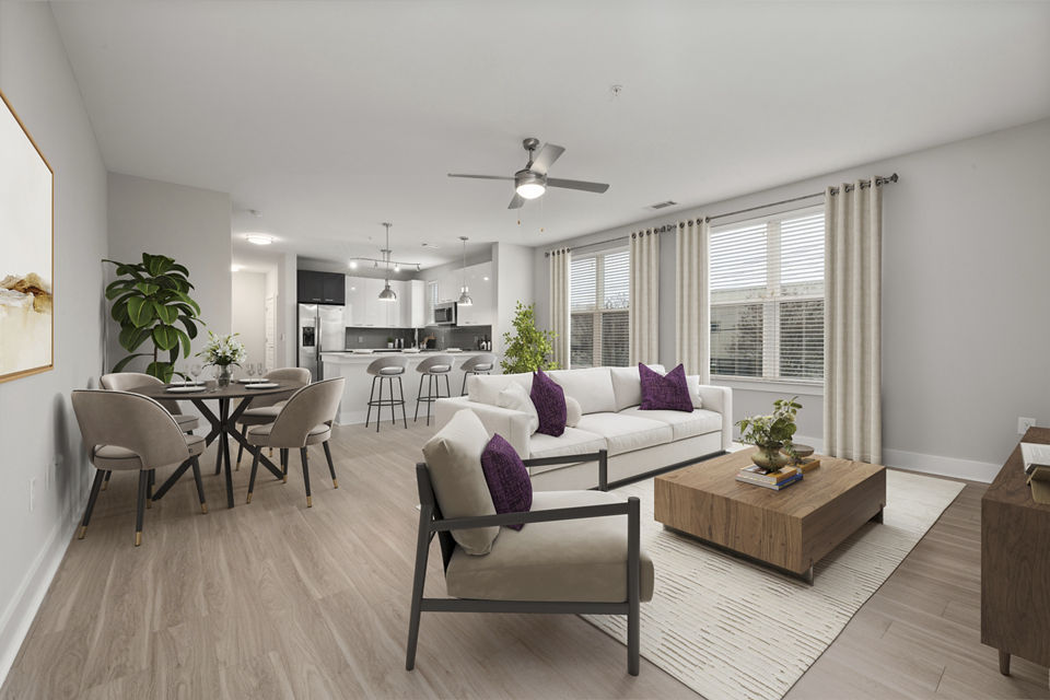 Spacious living room with modern decor in Cadence Music Factory Apartments