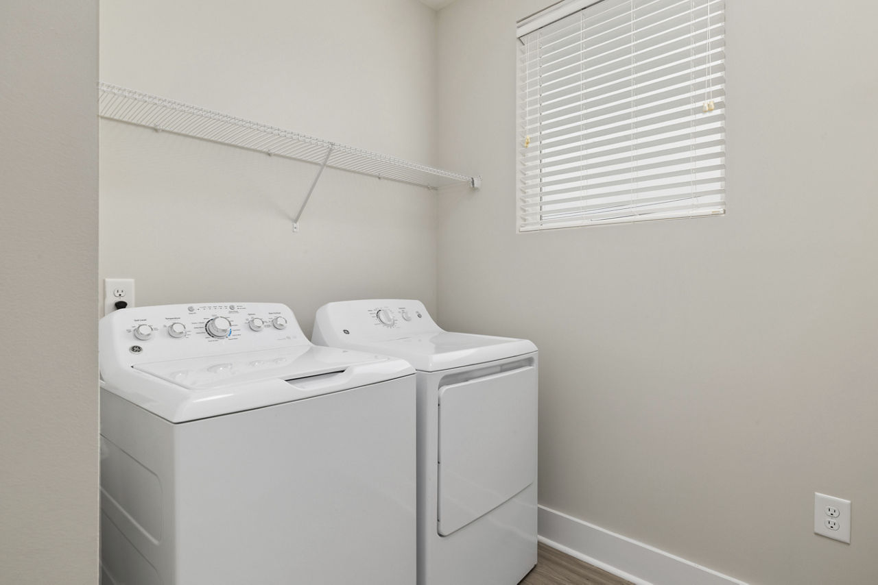 Laundry room at Cadence Music Factory Apartments