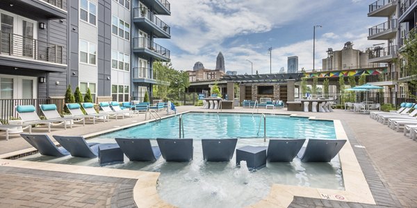 Resort-style swimming pool at Cadence Music Factory Apartments