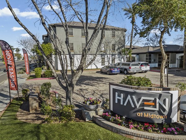 Haven at Midtown Apartments signage in urban setting showcasing luxury living options