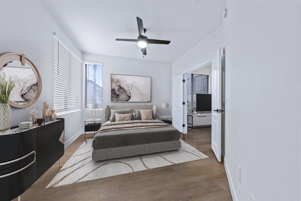 Haven at Midtown: Cozy bedroom with large windows and modern decor in luxury apartment
