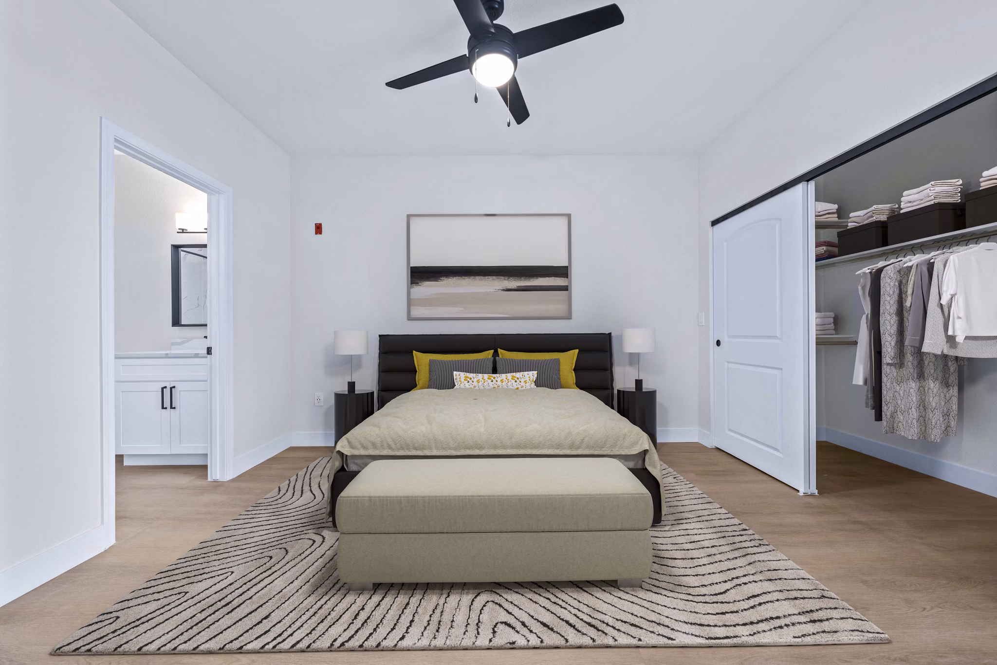 Modern bedroom with elegant furniture and large windows in Haven at Midtown Apartments