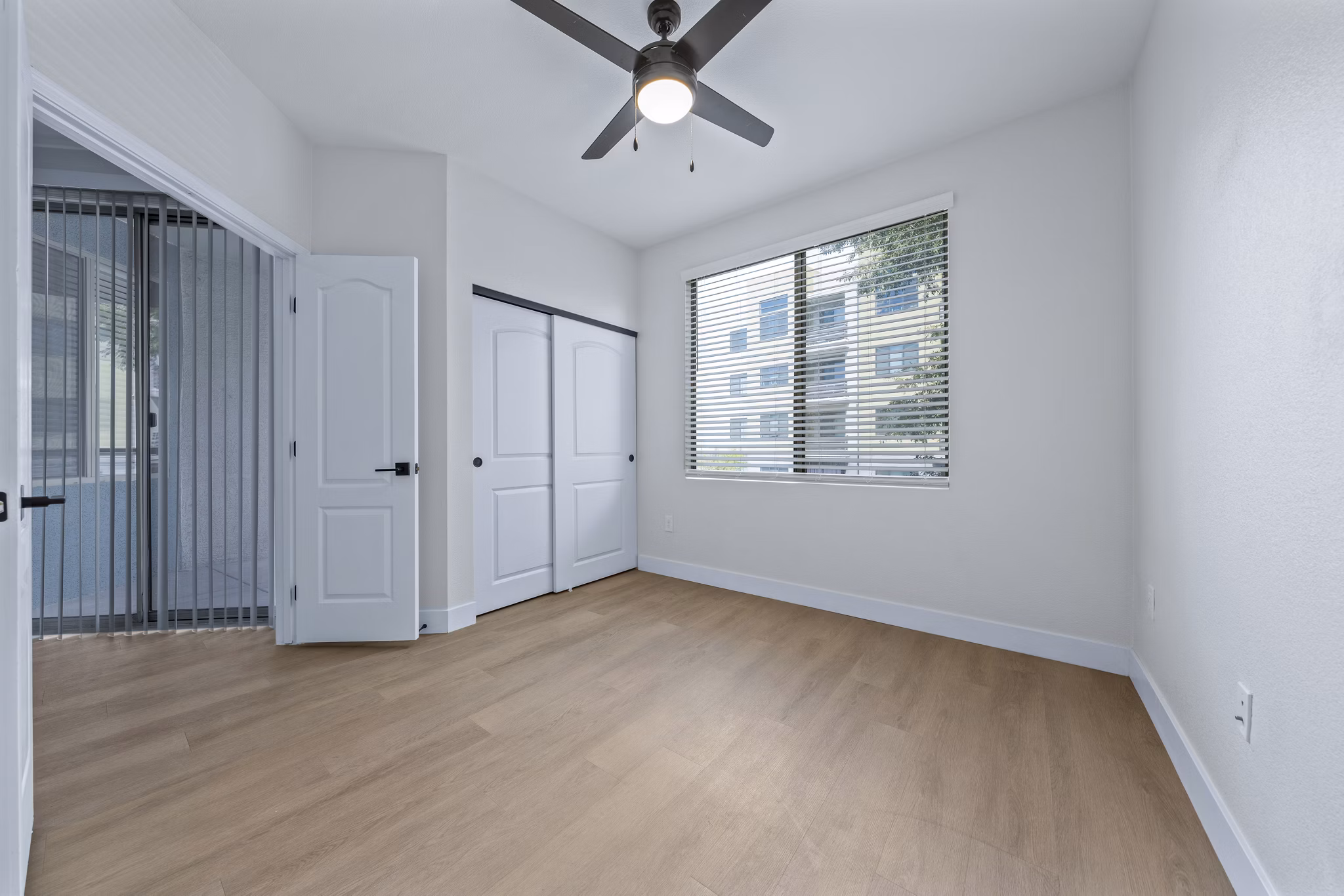 Bedroom with modern decor and large windows at Haven at Midtown Apartments, luxury living by Greystar in a vibrant urban setting