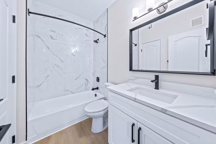 Haven at Midtown Apartments: Modern bathroom with sleek fixtures and tile accents