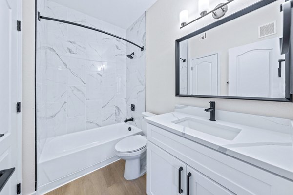 Haven at Midtown Apartments: Modern bathroom with sleek fixtures and tile accents