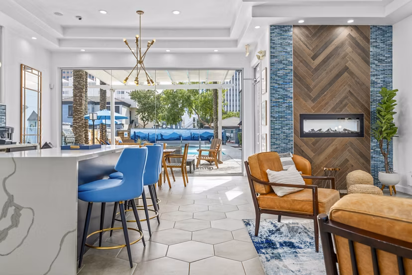 Haven at Midtown: Elegant clubhouse lobby featuring modern decor and plush seating, ideal for relaxing in luxury apartments