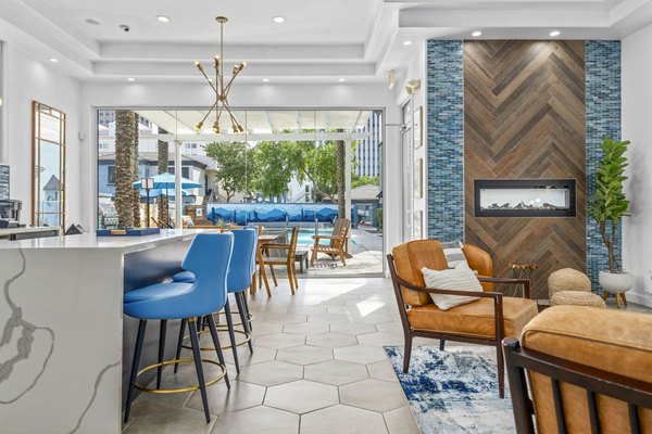 Haven at Midtown: Elegant clubhouse lobby featuring modern decor and plush seating, ideal for relaxing in luxury apartments