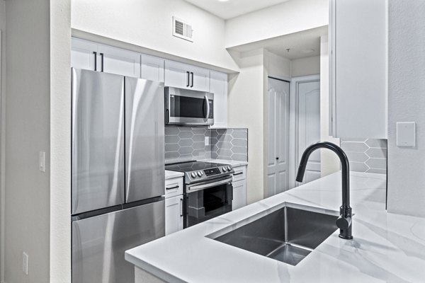 Haven at Midtown: Modern kitchen with stainless steel appliances and granite countertops