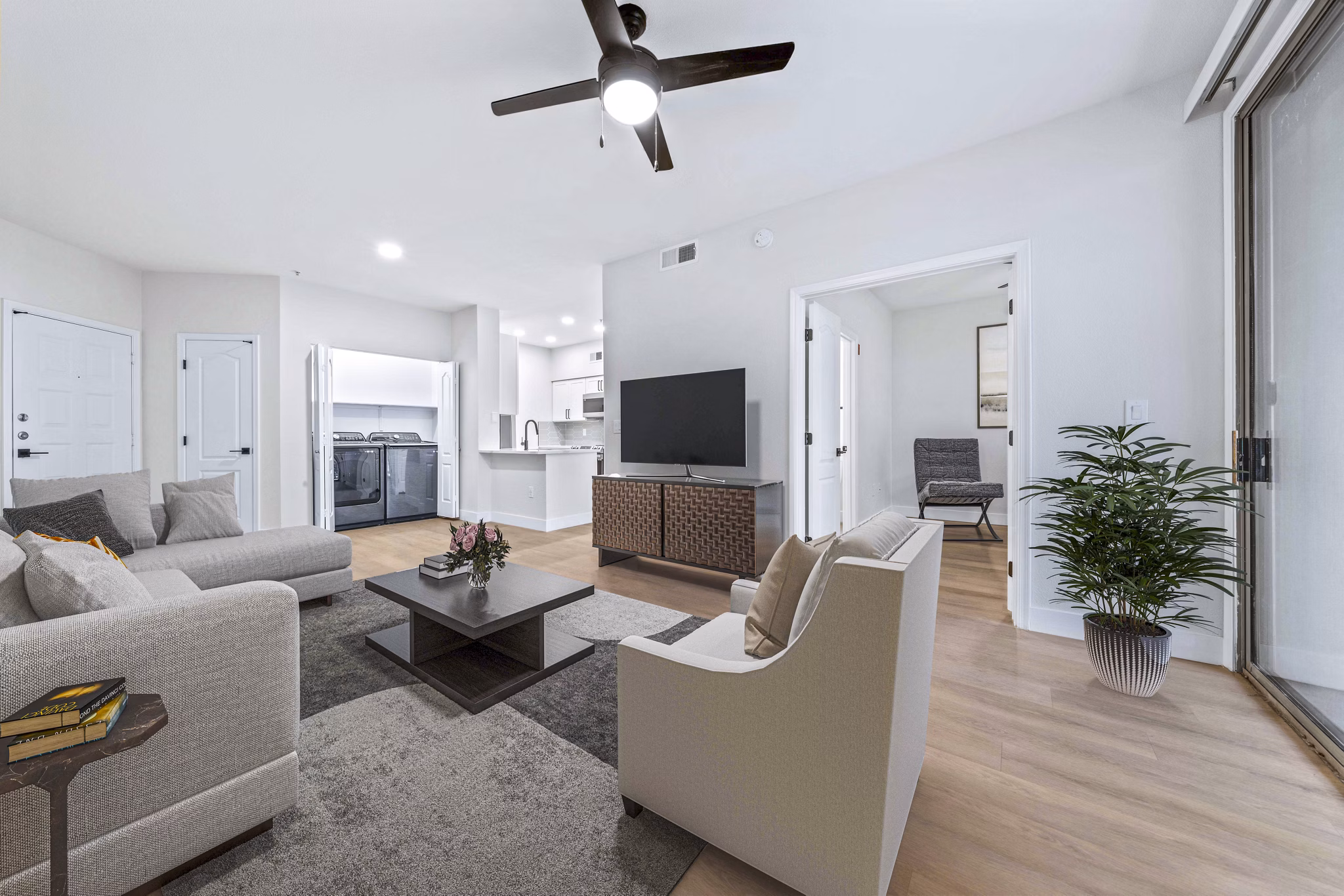 Spacious living room with modern decor and natural light in Haven at Midtown Apartments