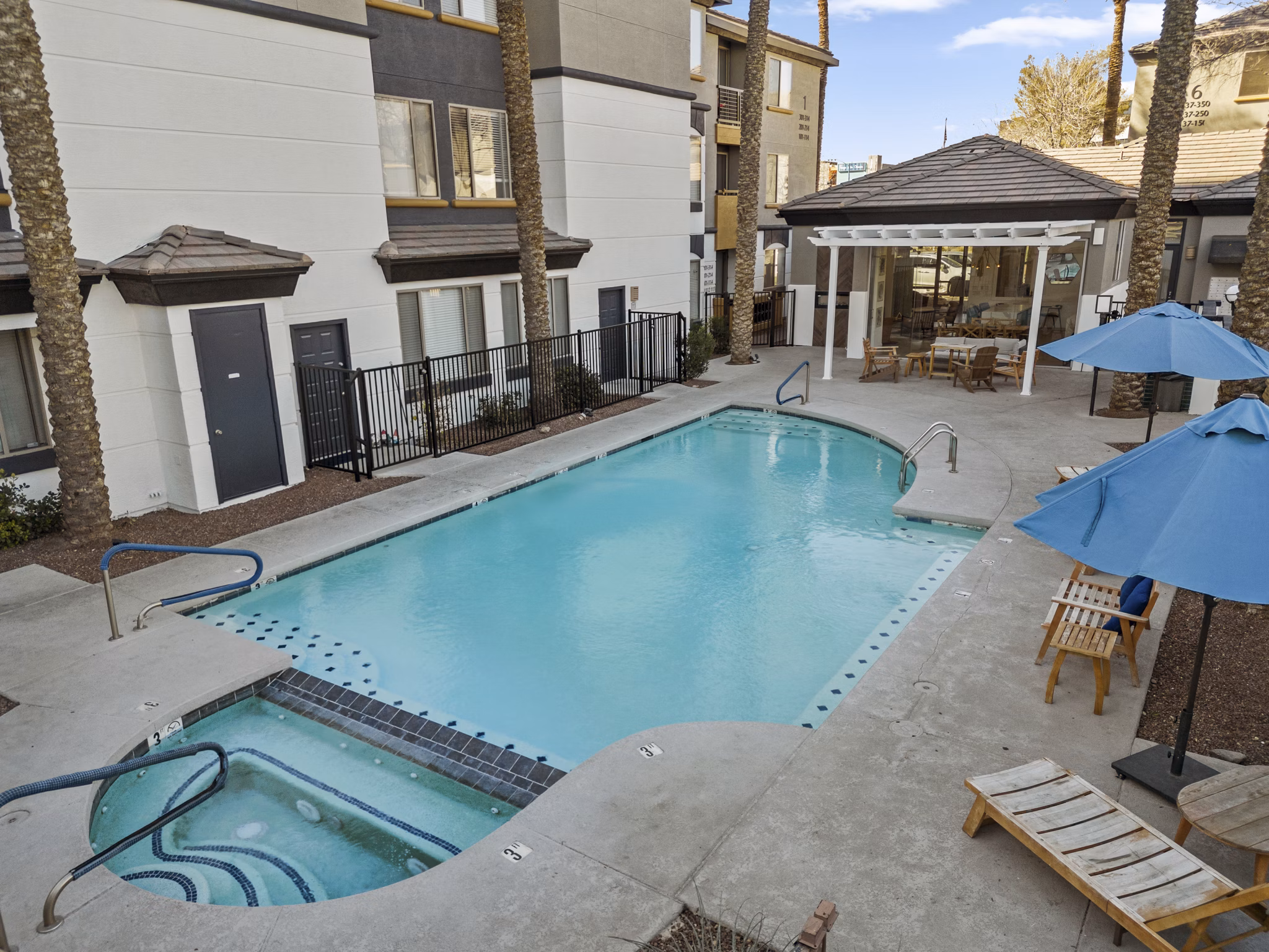 Modern outdoor pool area with lounge seating at Haven at Midtown Apartments