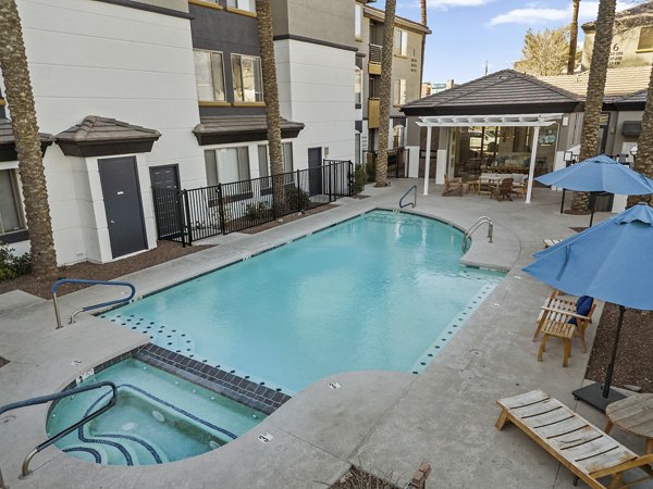 Modern outdoor pool area with lounge seating at Haven at Midtown Apartments