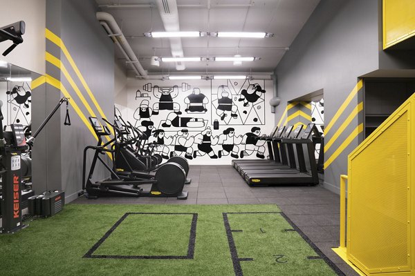 State-of-the-art fitness center with modern equipment at Anagram NoMad Apartments