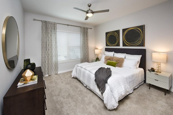 Elegant bedroom with modern decor at Overture Barrett Apartments