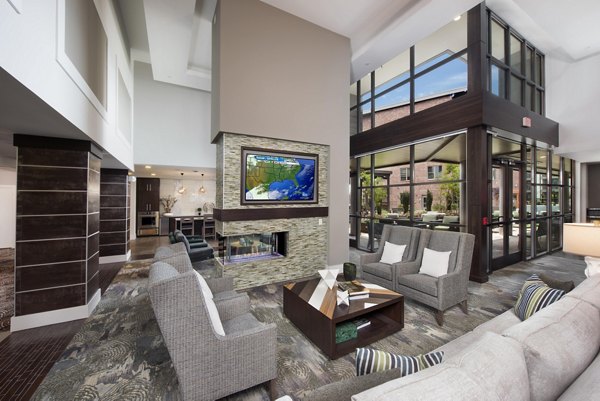 Clubhouse featuring modern furnishings and vibrant decor at Overture Barrett Apartments