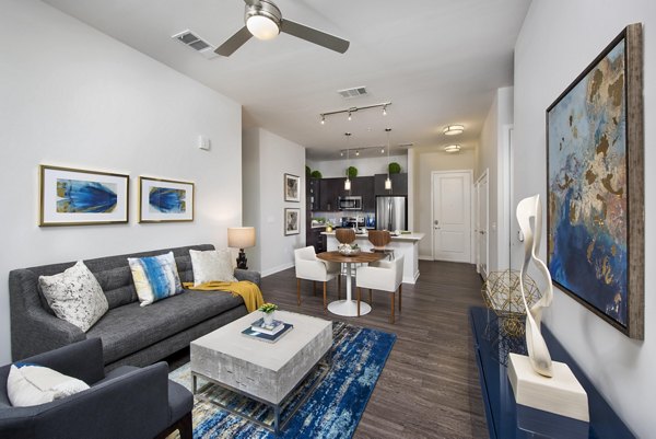 Spacious living room with modern decor and natural light at Overture Barrett Apartments