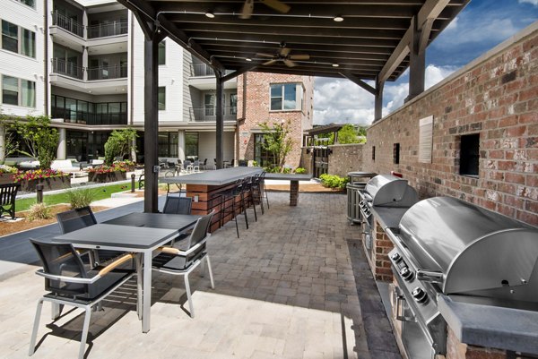 Patio area with stylish outdoor seating at Overture Barrett Apartments: A perfect spot for relaxation and social gatherings