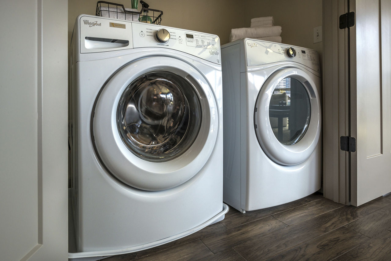 Laundry room at Ascent Victory Park Apartments