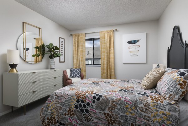 Comfortable bedroom with natural light at Vista at Trappers Glen Apartments