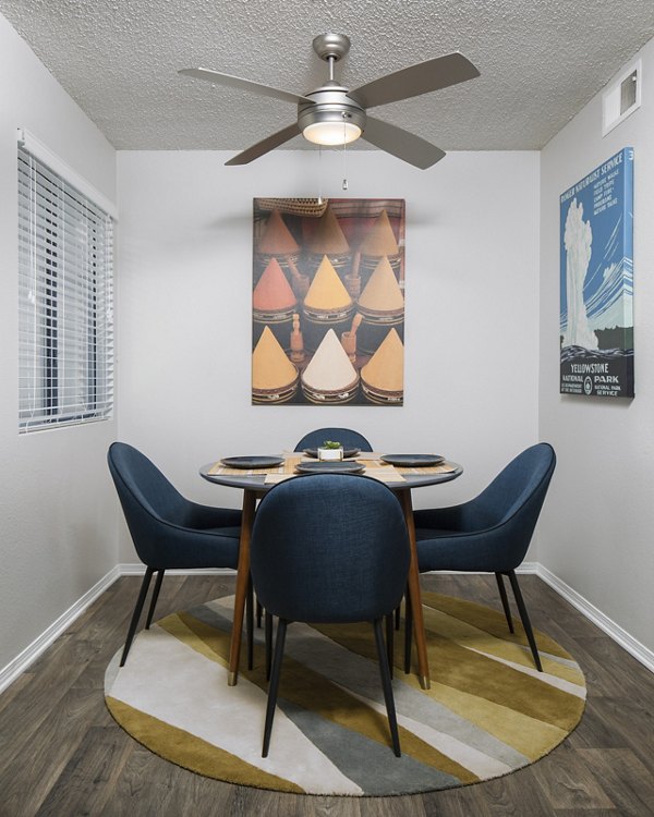 Dining room with elegant lighting and modern table setting at Vista at Trappers Glen Apartments
