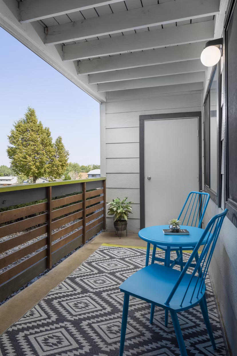 Patio with modern seating and fireplace at Vista at Trappers Glen Apartments