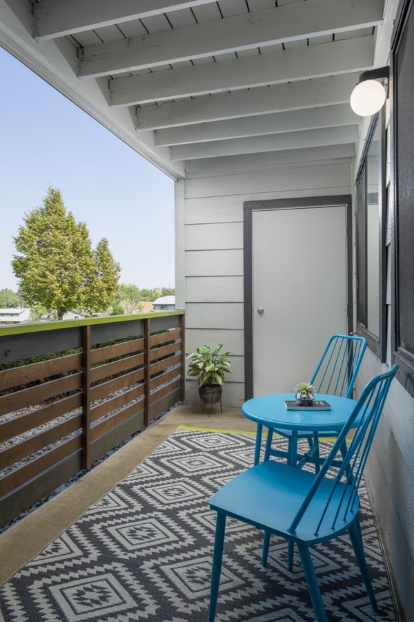 Patio with modern seating and fireplace at Vista at Trappers Glen Apartments