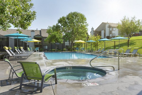 Stylish pool area at Vista at Trappers Glen Apartments offering relaxation and leisure for residents