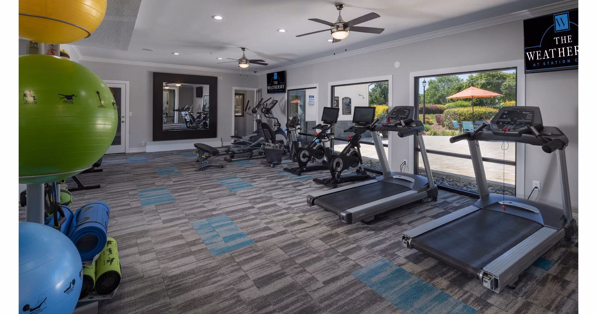 State-of-the-art fitness center with modern equipment at The Weathersby at Station Circle Apartments