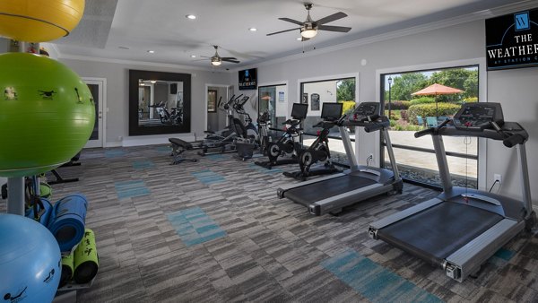 State-of-the-art fitness center with modern equipment at The Weathersby at Station Circle Apartments