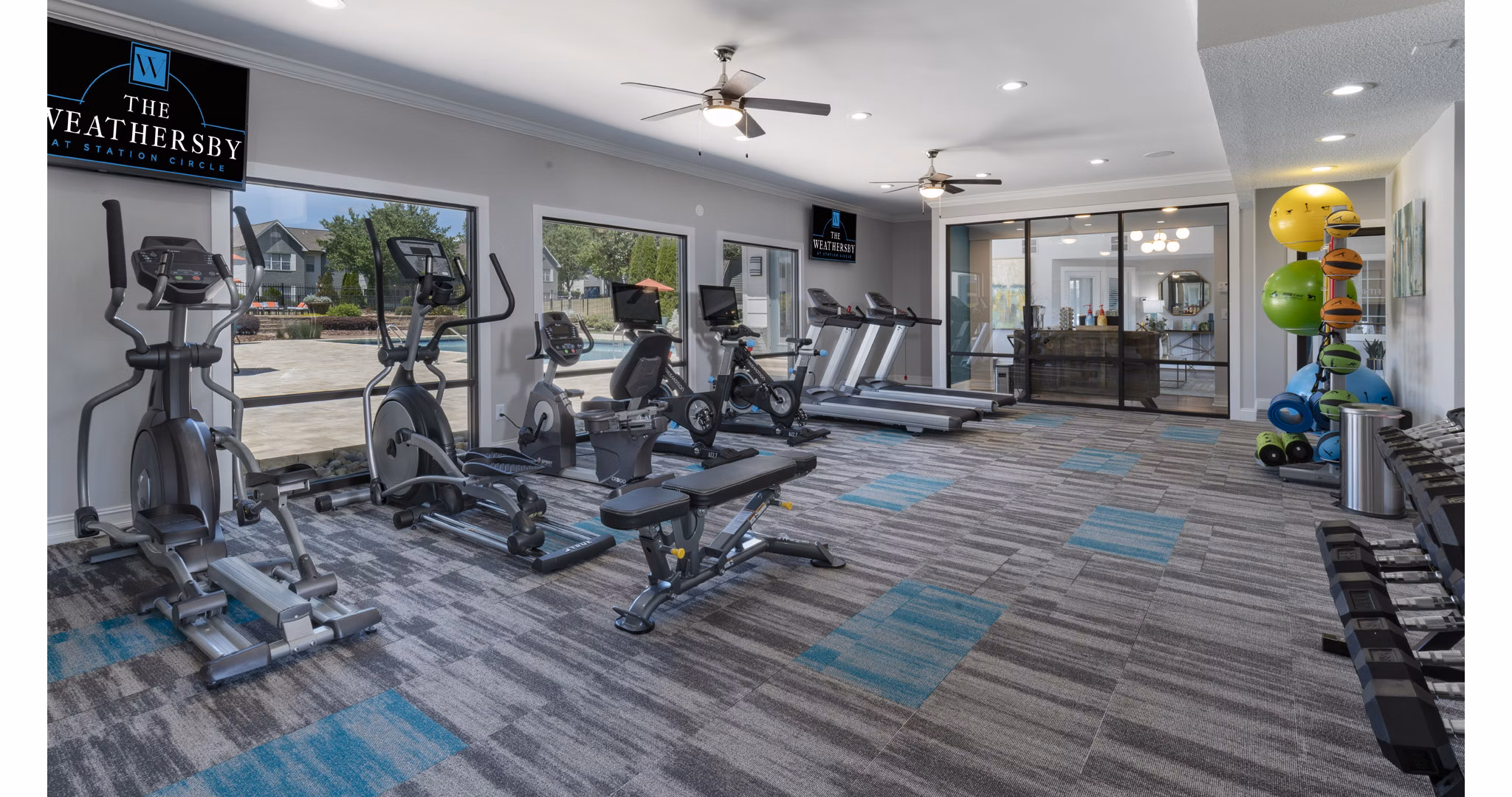 Modern fitness center with advanced equipment at The Weathersby at Station Circle Apartments in luxury Greystar community