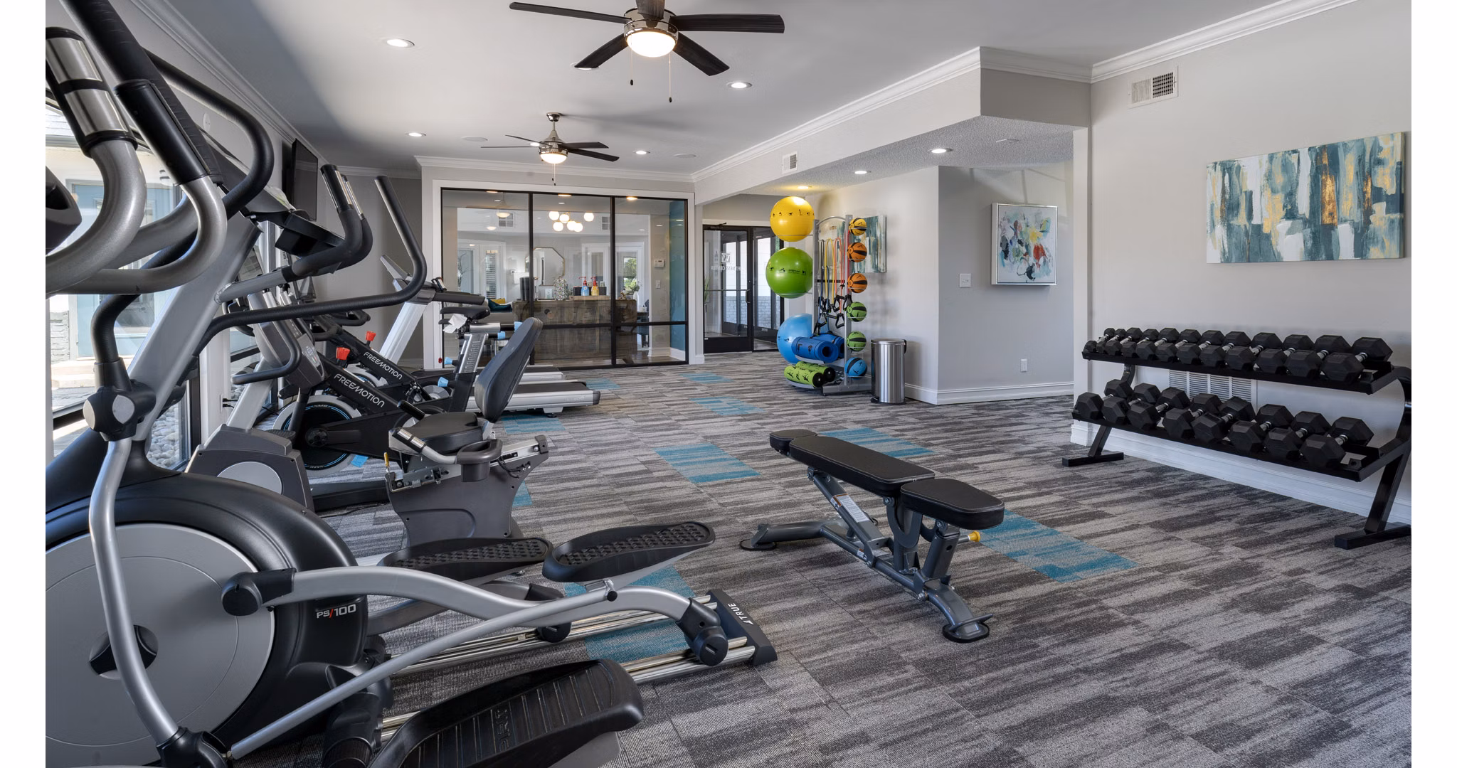 State-of-the-art fitness center with modern equipment at The Weathersby at Station Circle, a Greystar luxury apartment community