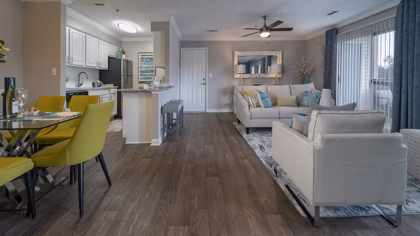 Spacious kitchen with granite countertops and stainless steel appliances in The Weathersby at Station Circle Apartments