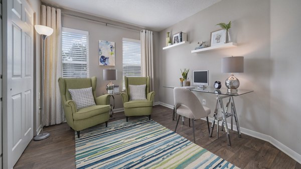 Open-concept kitchen with quartz countertops at The Weathersby at Station Circle Apartments