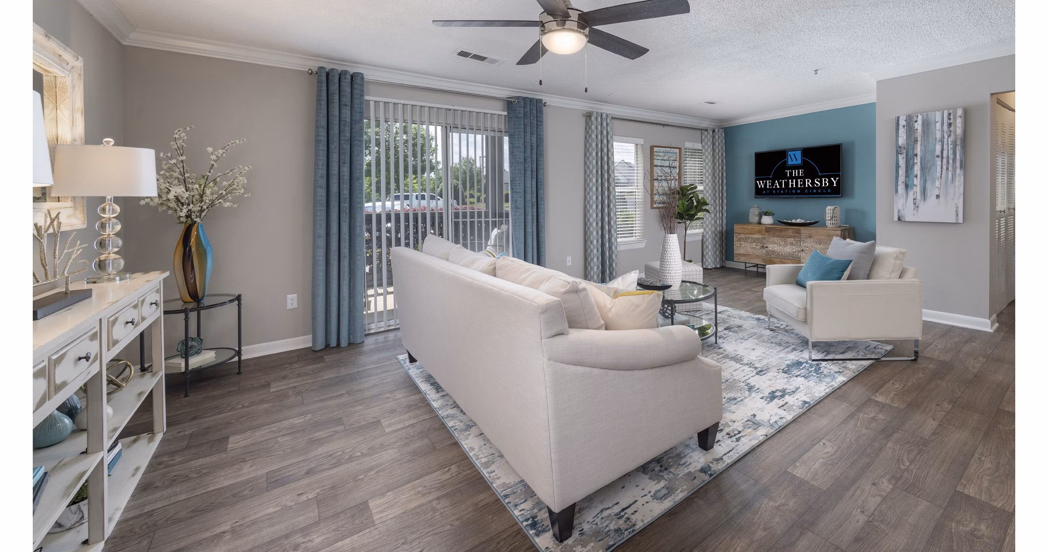 Spacious living room with modern decor in The Weathersby at Station Circle Apartments