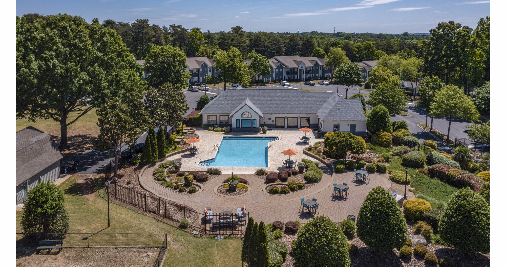 The Weathersby at Station Circle: Scenic view of luxury apartments amidst lush greenery