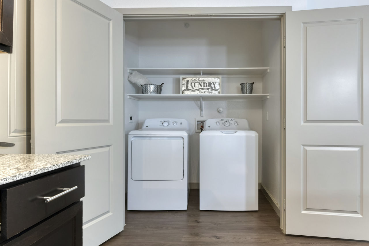 Laundry room at Rustico At Fair Oaks Apartments