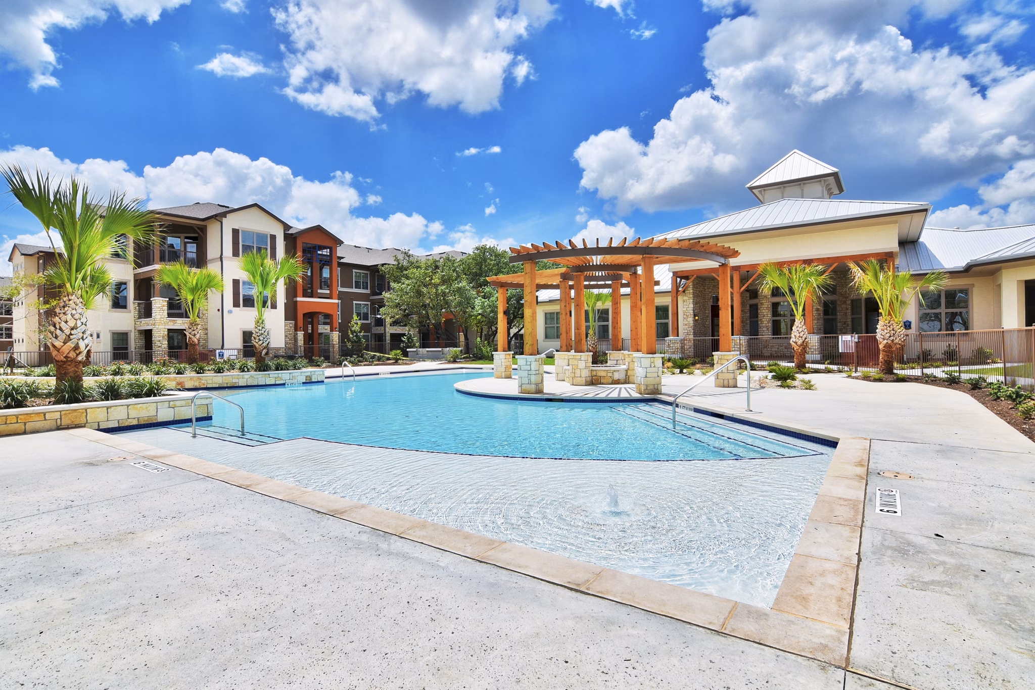 Modern outdoor pool at Azure Apartments offering luxurious relaxation spaces