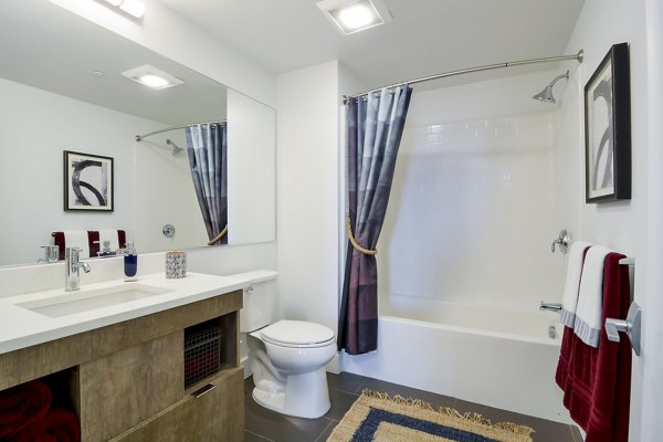 Bathroom with modern tile and fixtures at The Martin Apartments