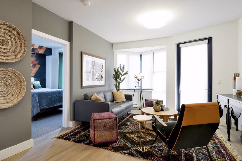 Modern living room with sleek furniture and natural light at The Martin luxury apartments in Seattle