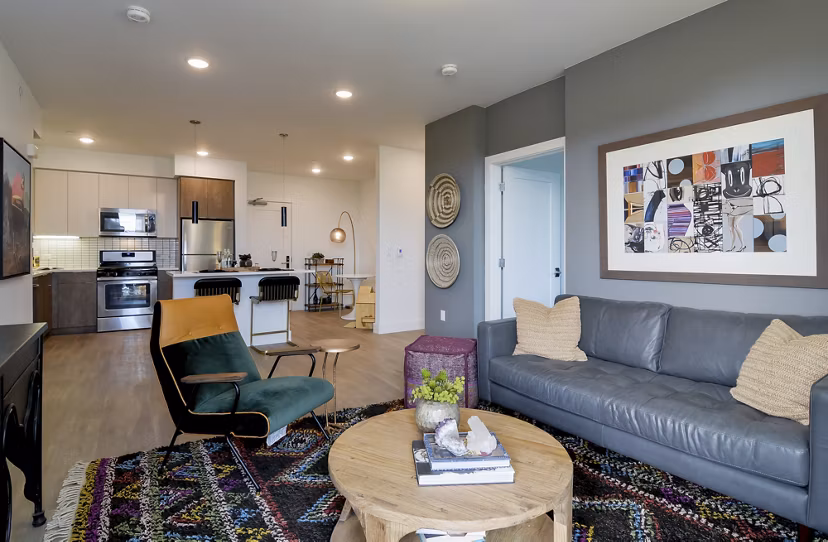 Spacious living room with modern decor and city views in The Martin Apartments, Seattle