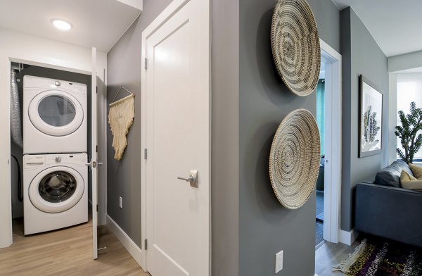 Modern laundry room with high-efficiency washers and dryers at The Martin Apartments, a Greystar luxury community in downtown