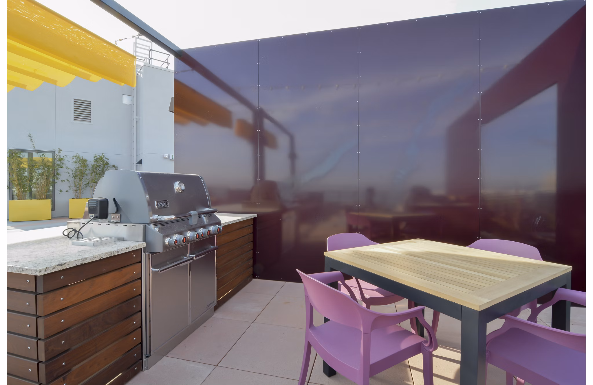 Rooftop patio with stylish seating and skyline views at The Martin Apartments