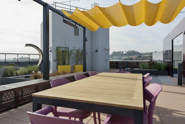 Rooftop patio with city skyline views at The Martin Apartments, offering luxury outdoor living spaces in downtown Seattle