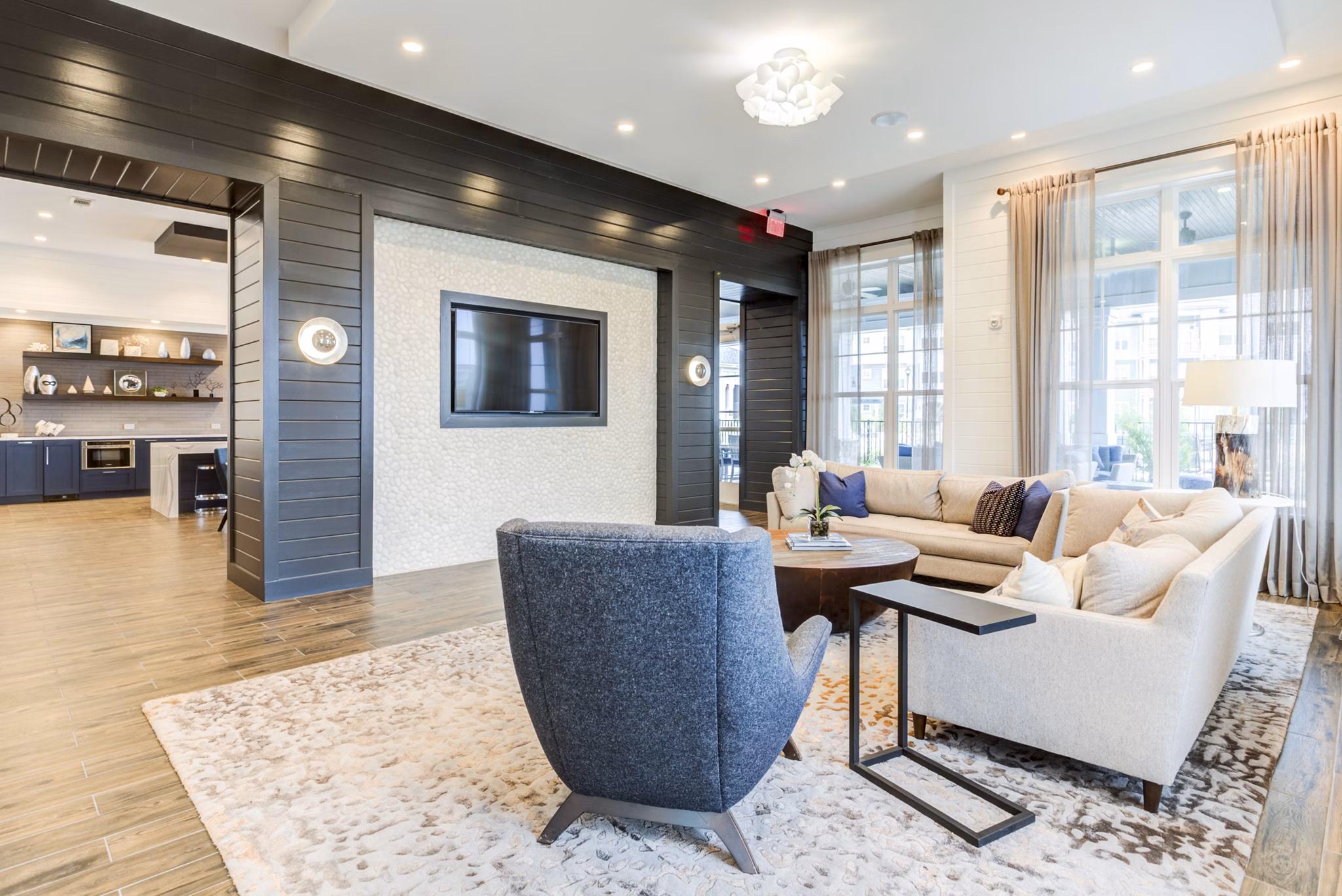 Modern clubhouse featuring cozy seating and open layout at Element Barclay Apartments, perfect for socializing and relaxation