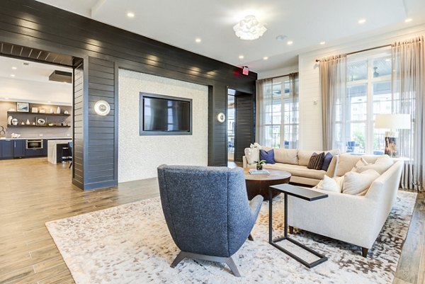 Modern clubhouse featuring cozy seating and open layout at Element Barclay Apartments, perfect for socializing and relaxation
